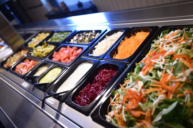 Chef preparing Nepalese cuisine at Ravintola Mantra kitchen